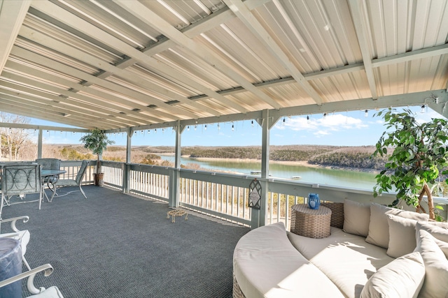 view of patio with outdoor lounge area and a water view