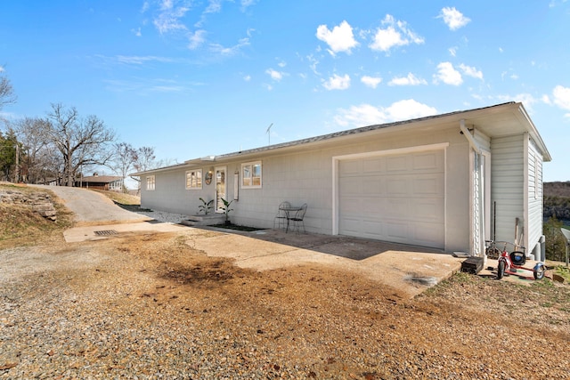 exterior space with an attached garage and driveway