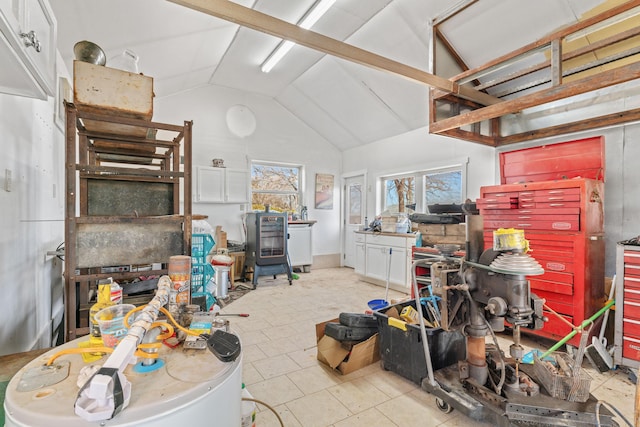 interior space featuring tile patterned flooring and vaulted ceiling