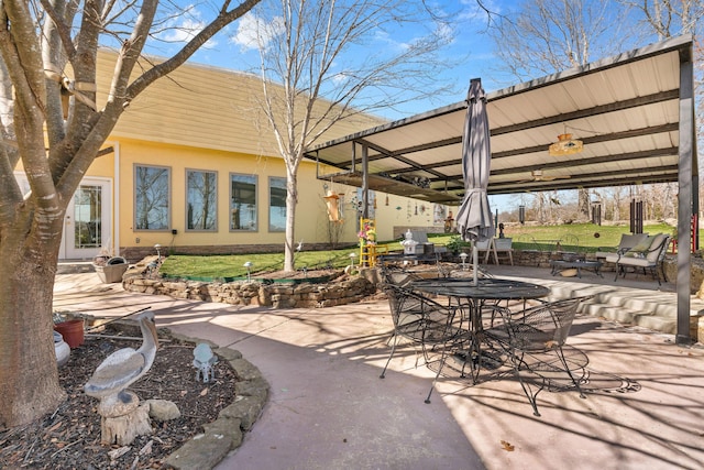 view of patio featuring outdoor dining area