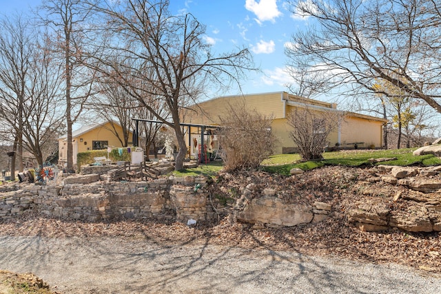 view of front of property featuring a patio area and stucco siding