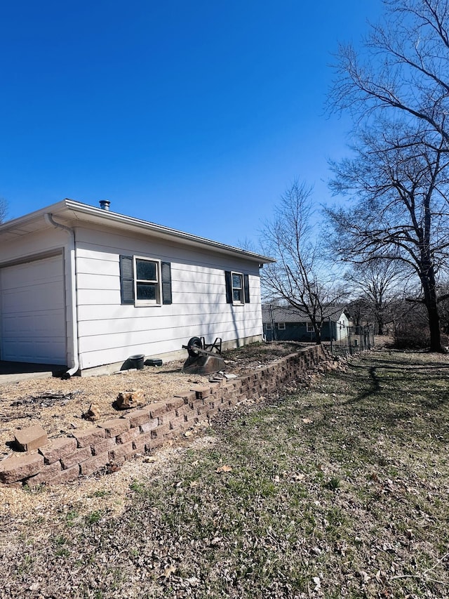 view of home's exterior featuring an attached garage