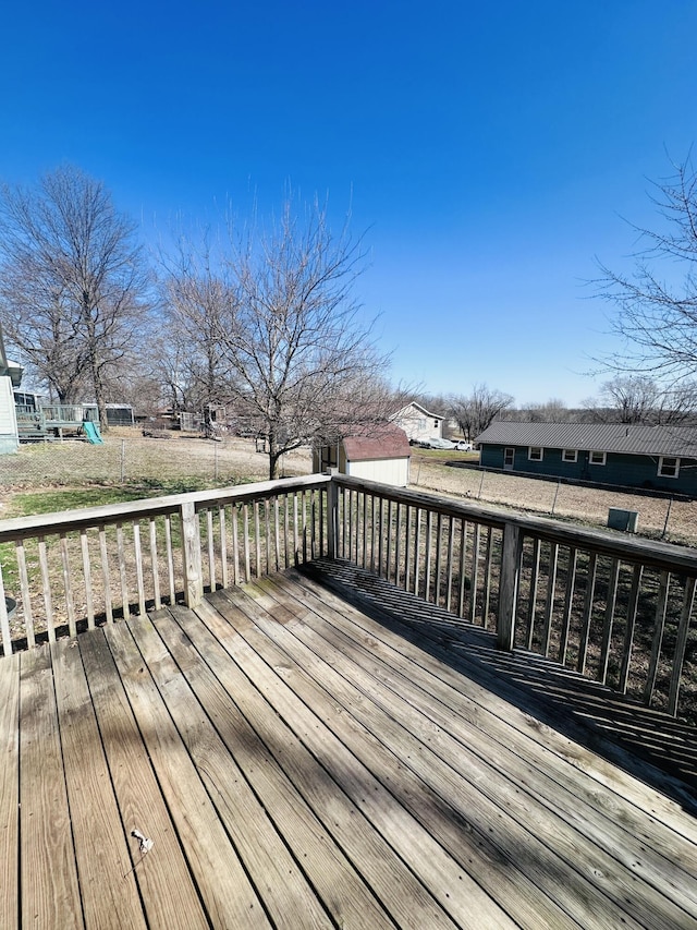 deck with an outdoor structure and a storage unit