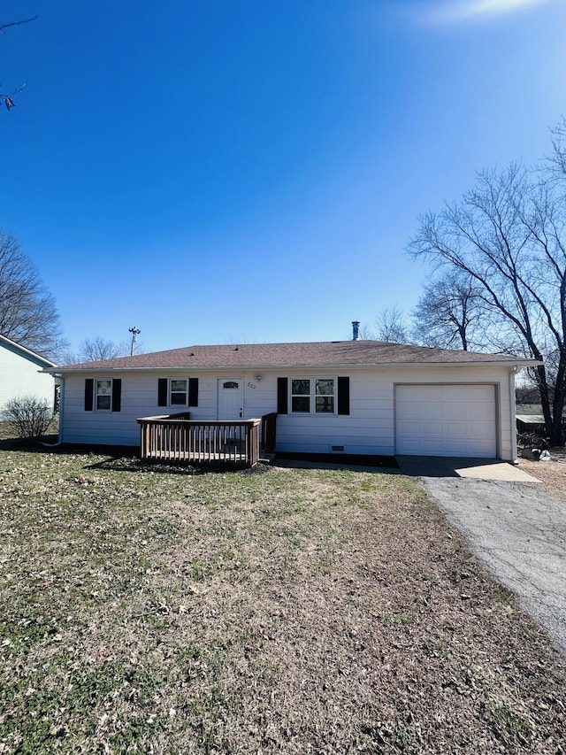 ranch-style house with driveway, a wooden deck, and an attached garage