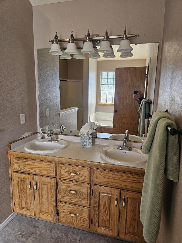 full bathroom with double vanity, a sink, a bath, and a shower stall