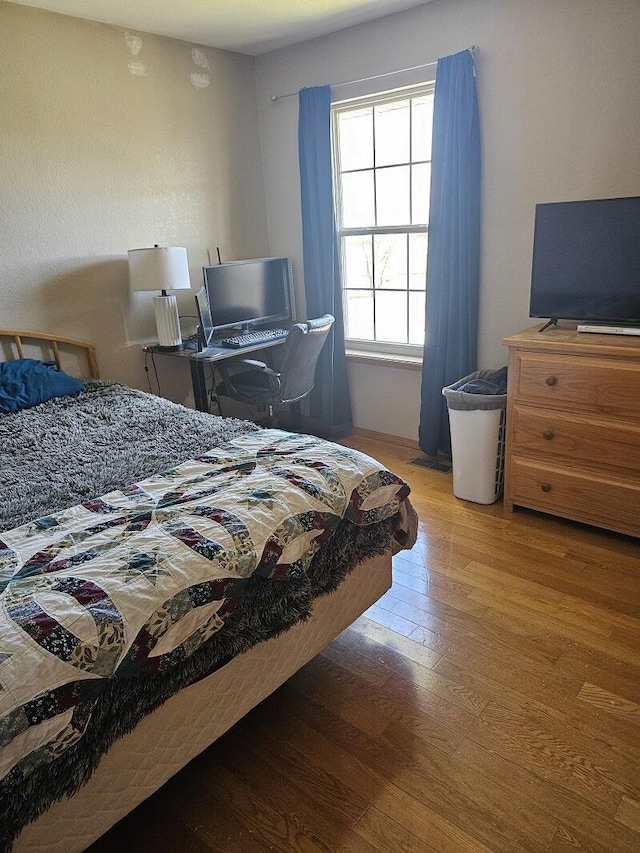 bedroom featuring wood-type flooring