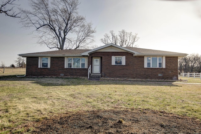 single story home with a front yard, crawl space, brick siding, and fence