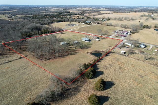 birds eye view of property featuring a rural view