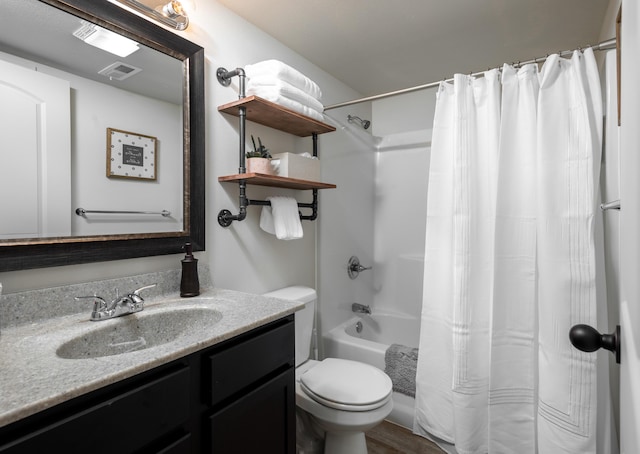 bathroom with toilet, shower / tub combo, visible vents, and vanity