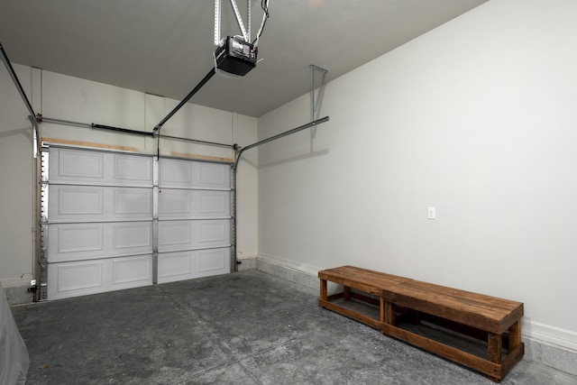 garage featuring baseboards and a garage door opener