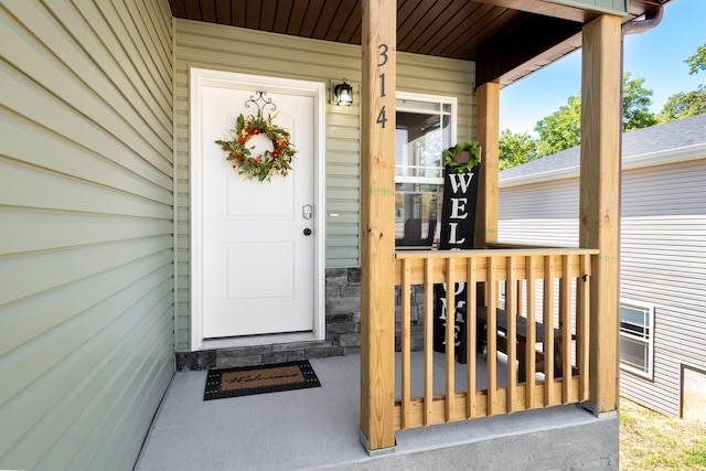 doorway to property featuring covered porch