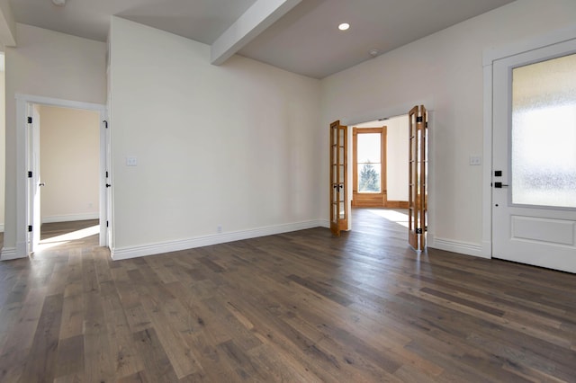 interior space featuring beam ceiling, baseboards, and dark wood-style flooring