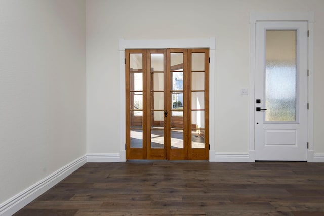 entryway featuring dark wood-style flooring and baseboards