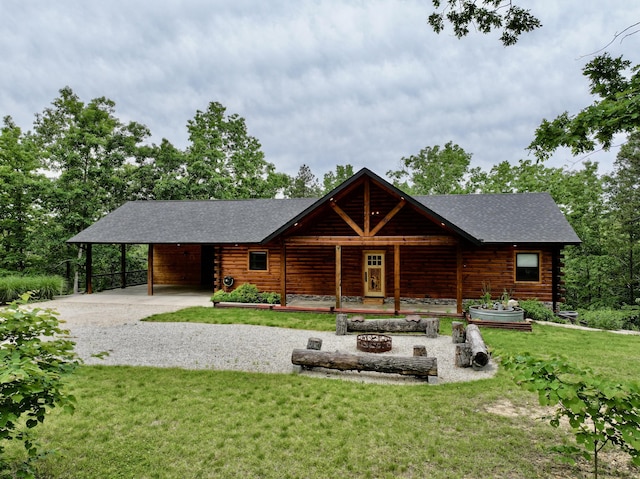 420 Nps Peavine, Van Buren, MO 63965 - log-style house with driveway, a front lawn, roof with shingles, and a carport