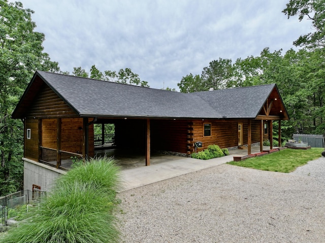 420 Nps Peavine, Van Buren, MO 63965 - view of front of property featuring gravel driveway, roof with shingles, covered porch, log siding, and fence