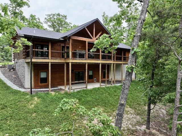 420 Nps Peavine, Van Buren, MO 63965 - back of property with central air condition unit, a patio, a yard, and log exterior
