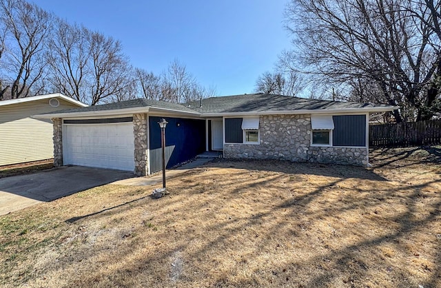 ranch-style home featuring a garage, stone siding, fence, and concrete driveway