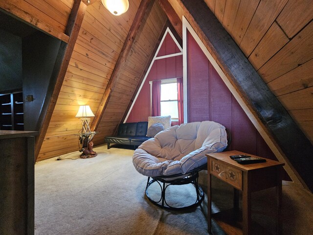 living area featuring lofted ceiling with beams, carpet floors, wood walls, and wooden ceiling