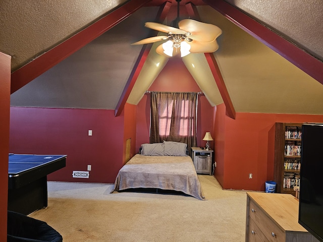 carpeted bedroom featuring lofted ceiling and a ceiling fan