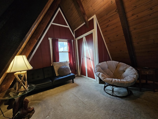 interior space with vaulted ceiling with beams, wooden ceiling, and carpet floors