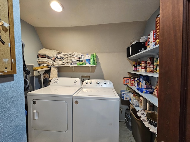 washroom with tile patterned flooring, laundry area, and separate washer and dryer