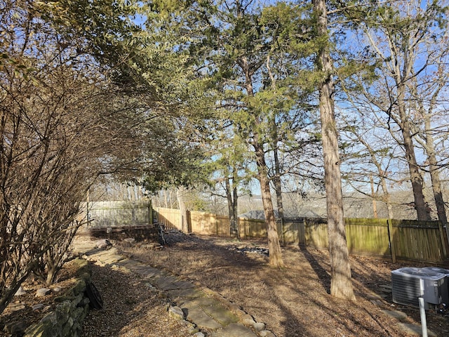 view of yard featuring cooling unit and a fenced backyard