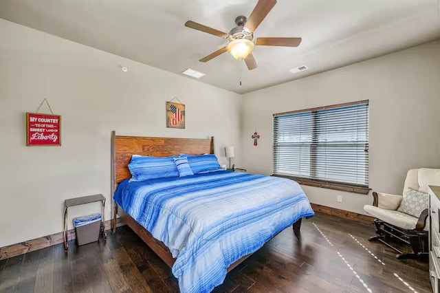 bedroom with wood-type flooring, visible vents, and baseboards