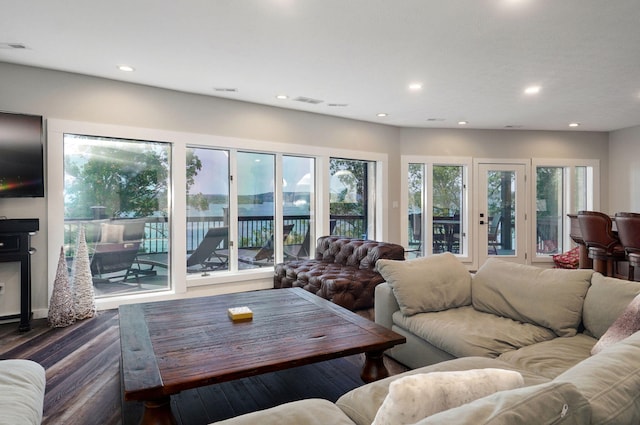 living area featuring wood finished floors and recessed lighting