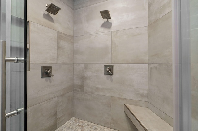 full bathroom with a tile shower