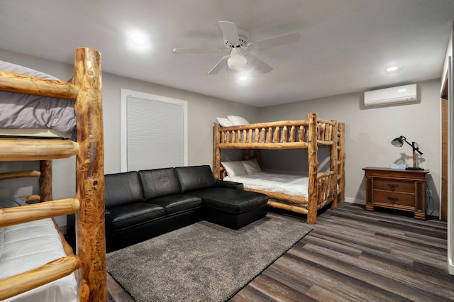 bedroom featuring a ceiling fan, recessed lighting, wood finished floors, and a wall mounted AC