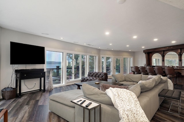 living room featuring french doors, dark wood finished floors, and recessed lighting