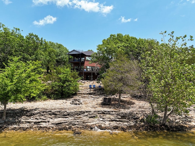 view of yard featuring a deck with water view