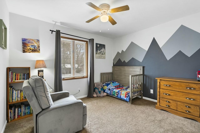 bedroom featuring carpet, baseboards, and a ceiling fan