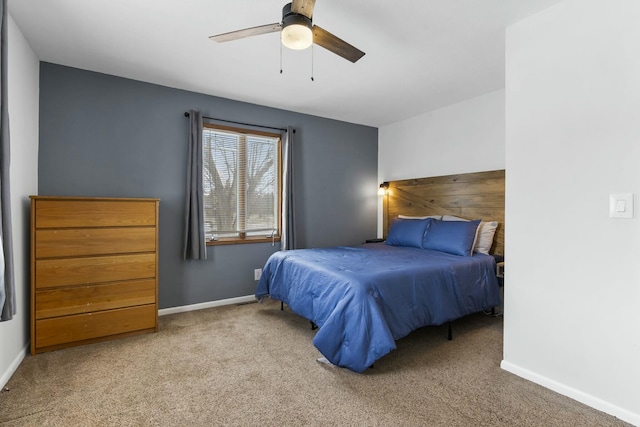 carpeted bedroom with a ceiling fan and baseboards