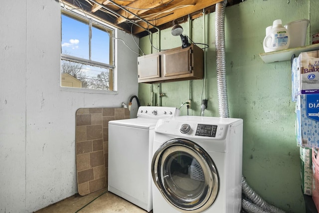 washroom featuring laundry area and washing machine and clothes dryer