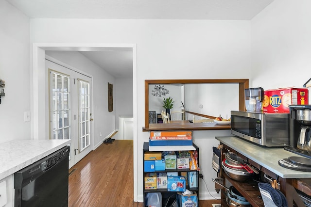 home office with french doors and wood finished floors