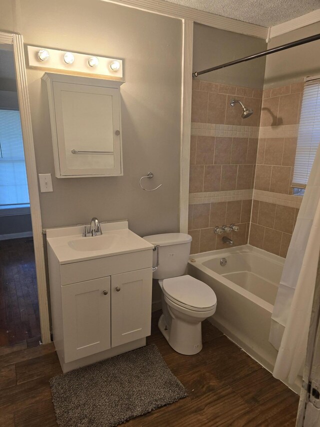 2140 N Roosevelt Ave, Springfield, MO 65803 - bathroom featuring shower / tub combo with curtain, vanity, and wood finished floors