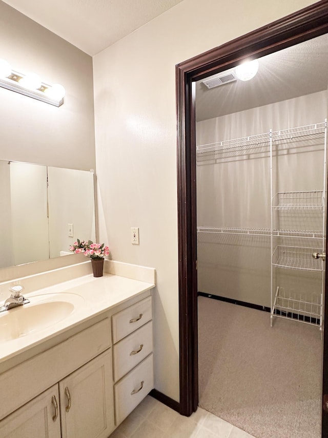 bathroom featuring visible vents and vanity