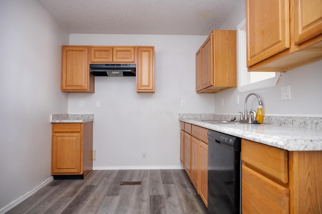 908 Jefferson Ave, Joplin, MO 64801 - kitchen featuring dishwasher, dark wood-type flooring, a textured ceiling, under cabinet range hood, and a sink