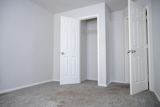 908 Jefferson Ave, Joplin, MO 64801 - unfurnished bedroom with carpet floors, a closet, and baseboards