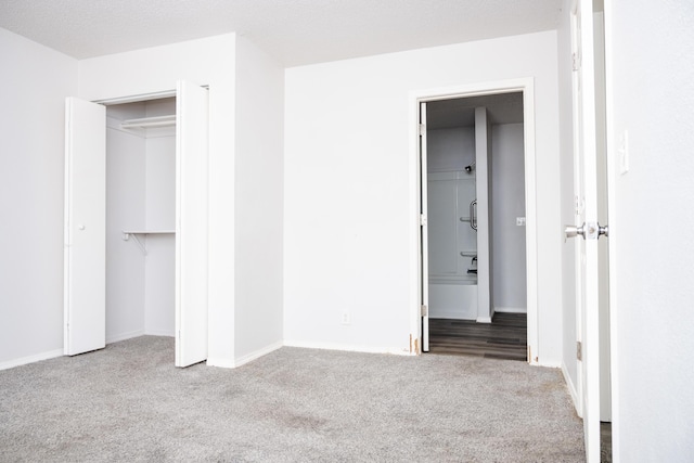 908 Jefferson Ave, Joplin, MO 64801 - unfurnished bedroom featuring a closet, carpet flooring, and baseboards