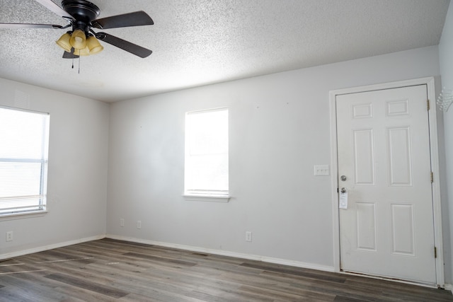908 Jefferson Ave, Joplin, MO 64801 - empty room with ceiling fan, a textured ceiling, baseboards, and wood finished floors