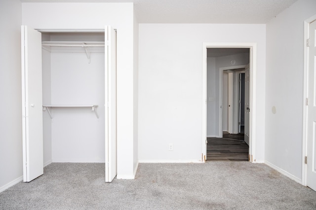 908 Jefferson Ave, Joplin, MO 64801 - unfurnished bedroom with a closet, carpet, and baseboards