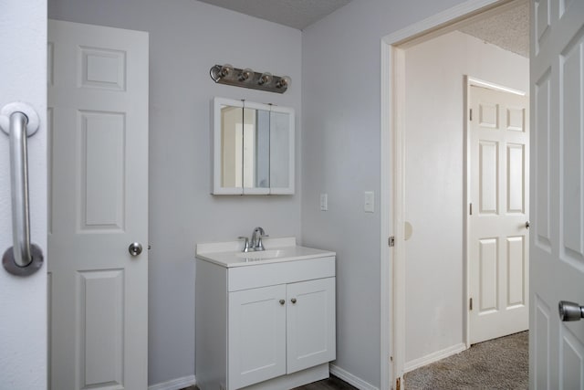 908 Jefferson Ave, Joplin, MO 64801 - bathroom with vanity and baseboards
