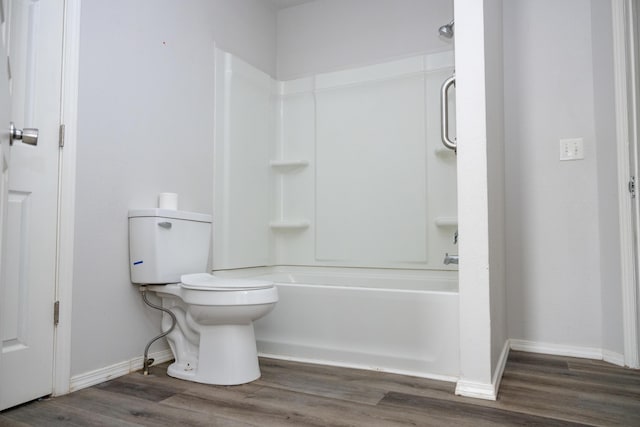 908 Jefferson Ave, Joplin, MO 64801 - bathroom featuring baseboards, toilet, and wood finished floors
