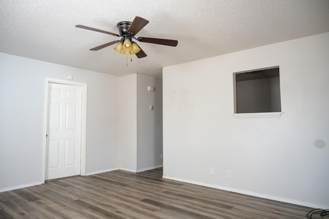 908 Jefferson Ave, Joplin, MO 64801 - empty room featuring a textured ceiling, ceiling fan, wood finished floors, and baseboards