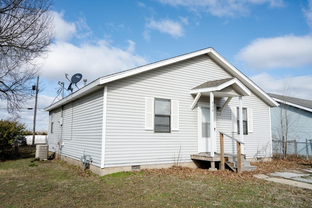 908 Jefferson Ave, Joplin, MO 64801 - exterior space with central AC, crawl space, fence, and a lawn