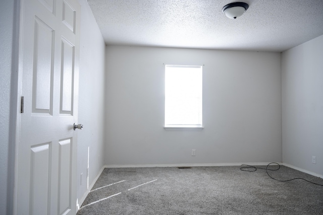 908 Jefferson Ave, Joplin, MO 64801 - unfurnished room with a textured ceiling and carpet flooring