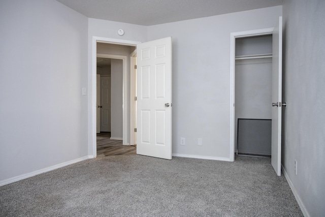 908 Jefferson Ave, Joplin, MO 64801 - unfurnished bedroom featuring carpet, baseboards, and a closet