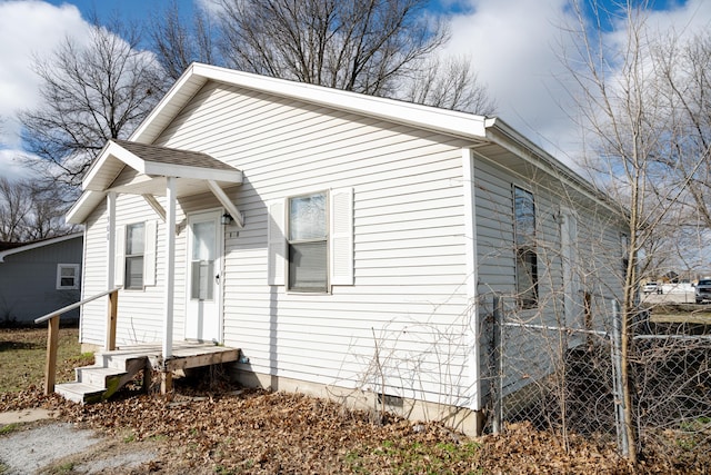 908 Jefferson Ave, Joplin, MO 64801 - view of side of home featuring crawl space and roof with shingles
